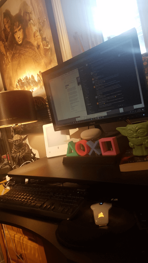 Office setup with accessories and Yoda mug